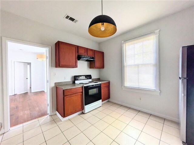 kitchen featuring range with electric stovetop and light tile patterned flooring