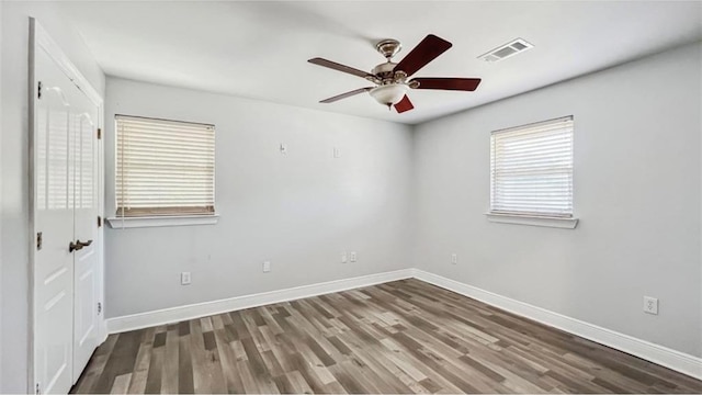 empty room featuring hardwood / wood-style floors and ceiling fan