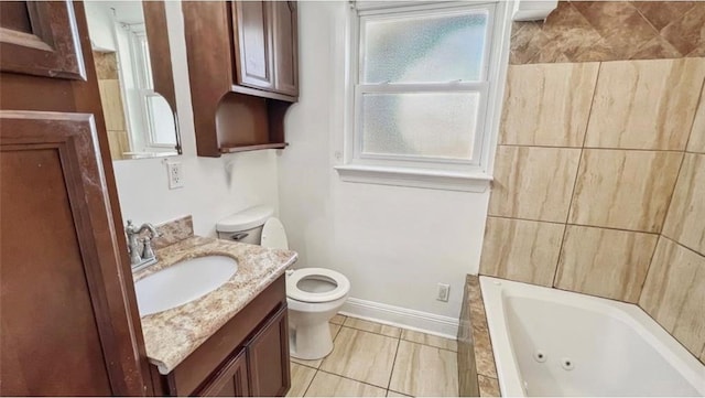 bathroom with tile patterned flooring, a bathing tub, toilet, and vanity