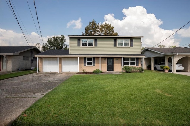 view of property with a garage and a front lawn