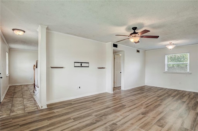 unfurnished room with a textured ceiling, ceiling fan, and hardwood / wood-style flooring