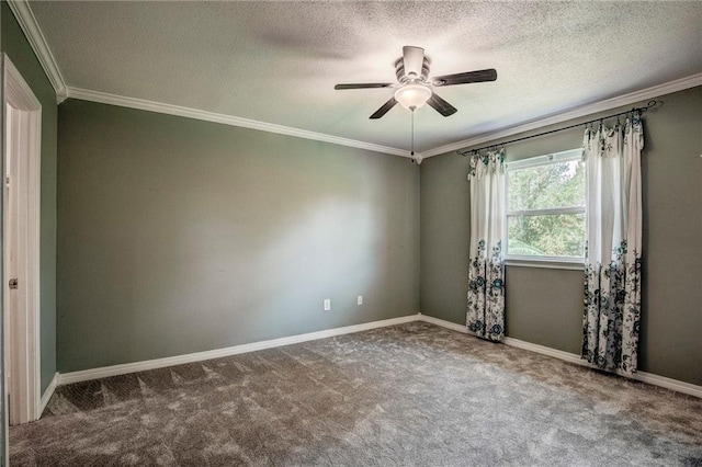 carpeted empty room featuring ceiling fan, crown molding, and a textured ceiling