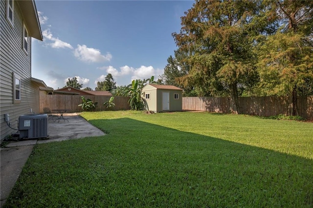 view of yard with a storage shed, a patio, and central air condition unit