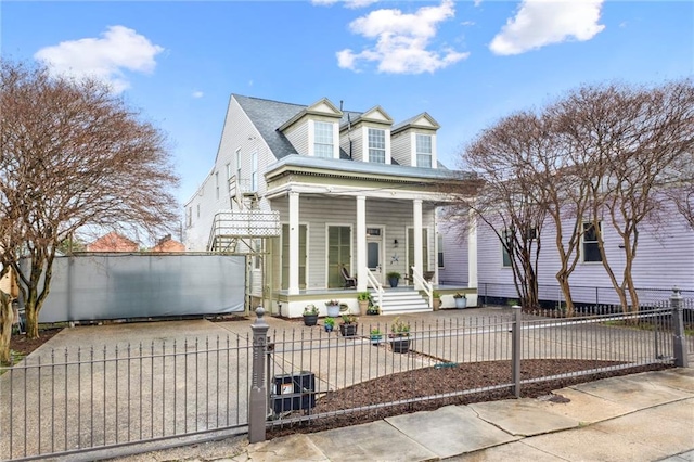 cape cod-style house with a porch