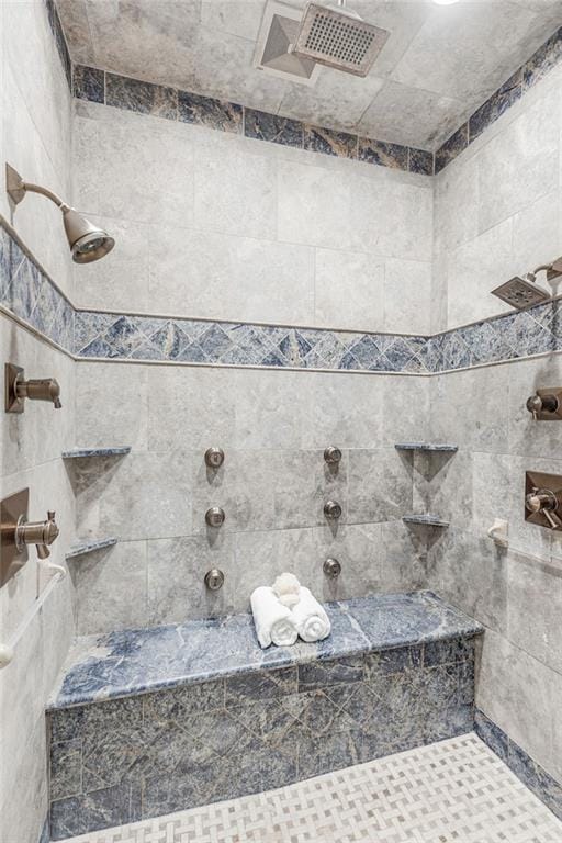 bathroom featuring tiled shower