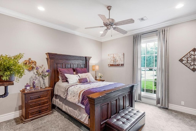 carpeted bedroom featuring crown molding and ceiling fan