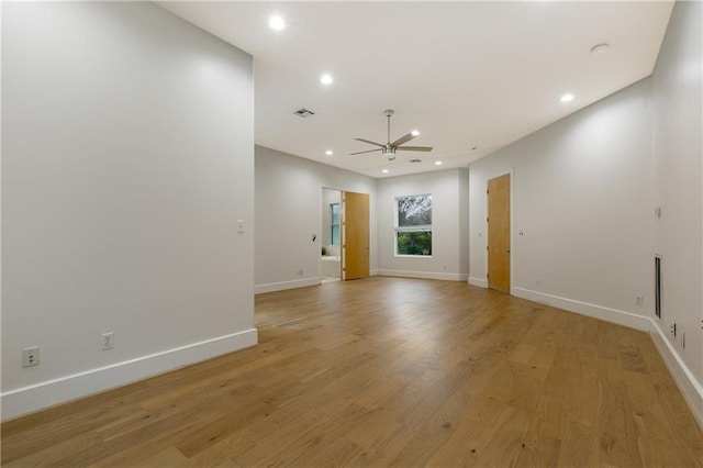 unfurnished living room featuring ceiling fan and light hardwood / wood-style flooring