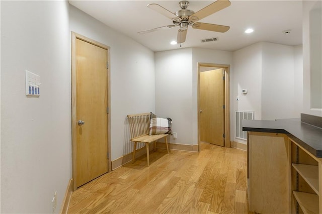 hallway with light wood-type flooring