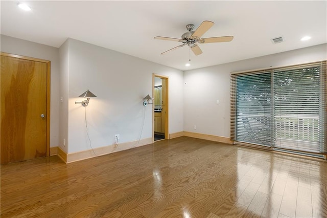 unfurnished room featuring wood-type flooring and ceiling fan