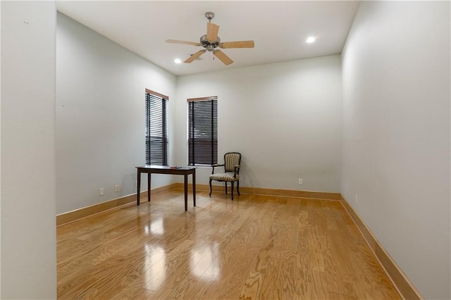 spare room featuring ceiling fan and light hardwood / wood-style flooring