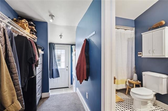 bathroom featuring tile patterned floors and toilet