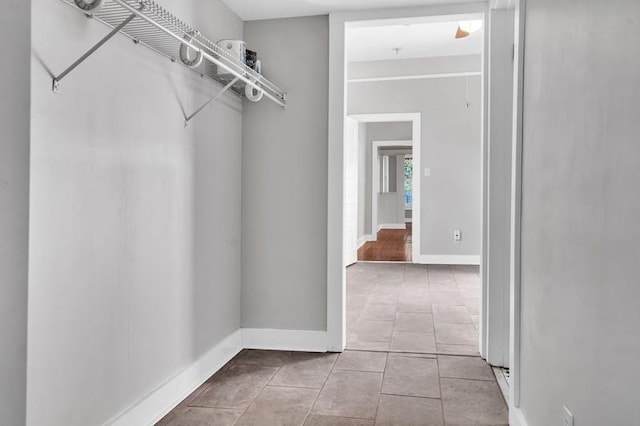 spacious closet featuring light tile patterned floors