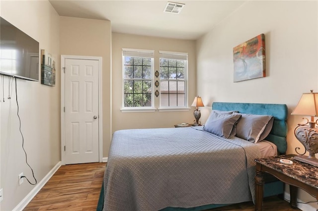 bedroom featuring hardwood / wood-style floors