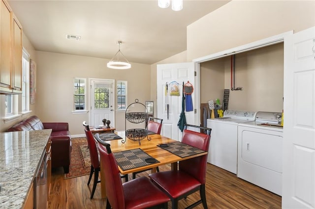 dining room with separate washer and dryer and dark hardwood / wood-style floors