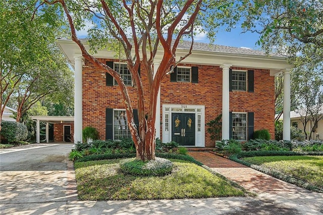 view of front of home with a carport