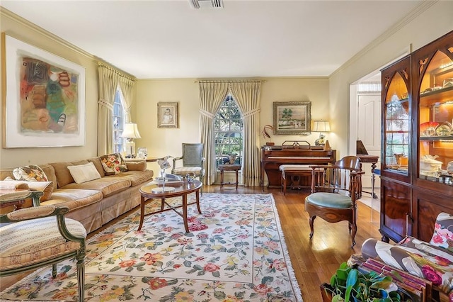 living room featuring crown molding and dark hardwood / wood-style flooring