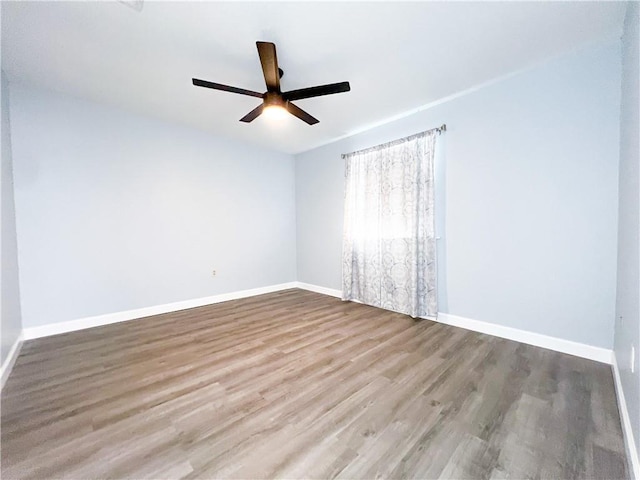 spare room with ceiling fan and light hardwood / wood-style floors