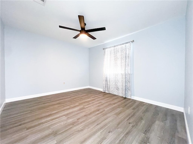 empty room with light hardwood / wood-style floors and ceiling fan