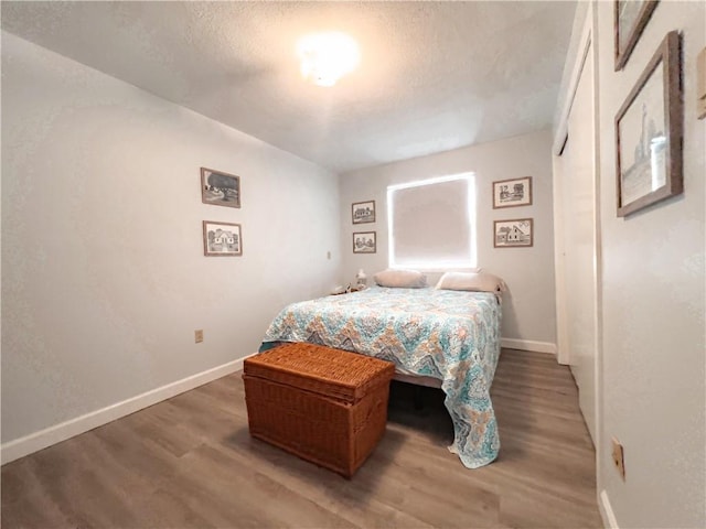 bedroom featuring hardwood / wood-style flooring