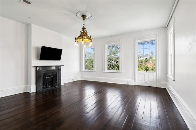 unfurnished living room featuring dark wood-type flooring