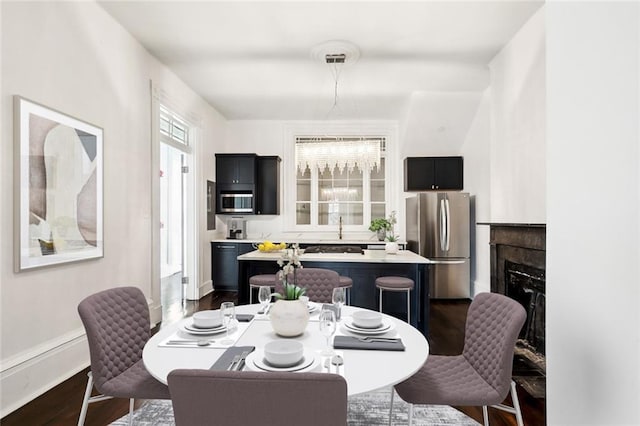 dining room with dark hardwood / wood-style floors