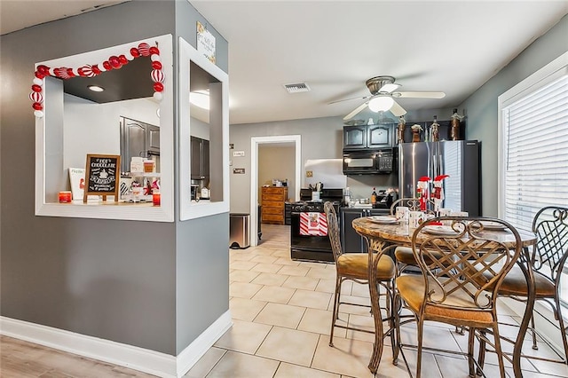 dining room featuring ceiling fan