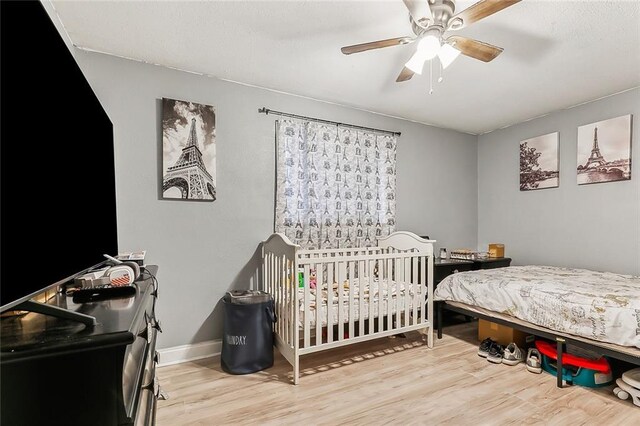 2329 Nile St, Gretna, LA 70056 - bedroom with wood finished floors, a ceiling fan, and baseboards