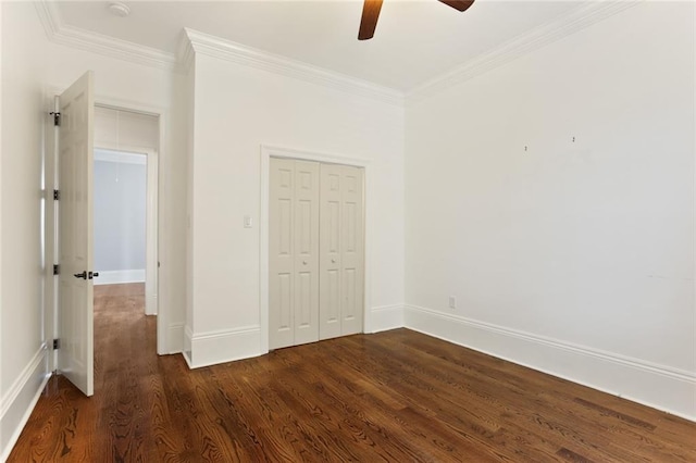 unfurnished bedroom featuring ornamental molding, dark hardwood / wood-style floors, ceiling fan, and a closet