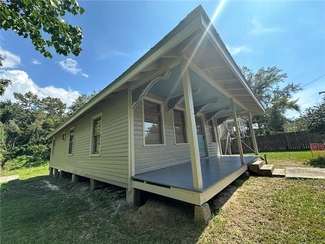 view of side of home featuring a yard