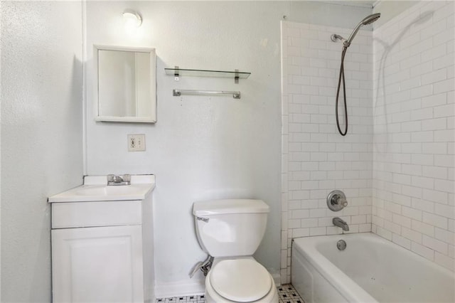 full bathroom featuring vanity, tiled shower / bath combo, toilet, and tile patterned flooring