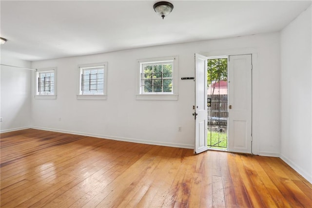 spare room with hardwood / wood-style floors