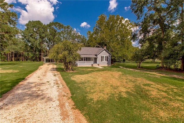 view of front of home featuring a front yard and a porch