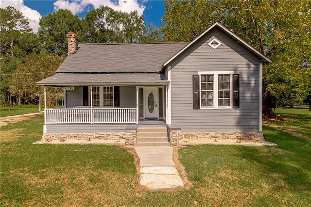 view of front of home with a front lawn and covered porch