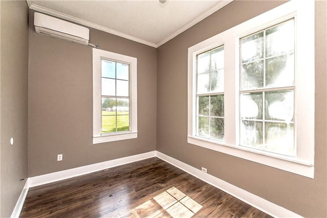 unfurnished room featuring dark wood-type flooring, crown molding, and a wall mounted air conditioner