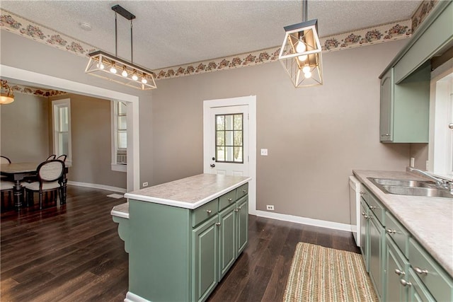 kitchen with green cabinetry, a textured ceiling, a center island, dark hardwood / wood-style floors, and sink