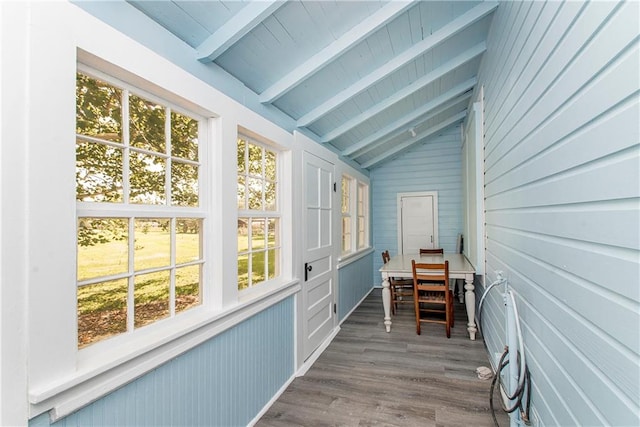 sunroom / solarium with lofted ceiling with beams