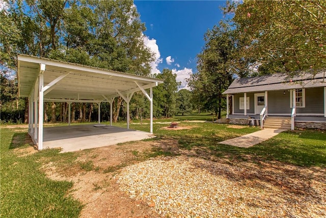 view of yard featuring a carport and a porch