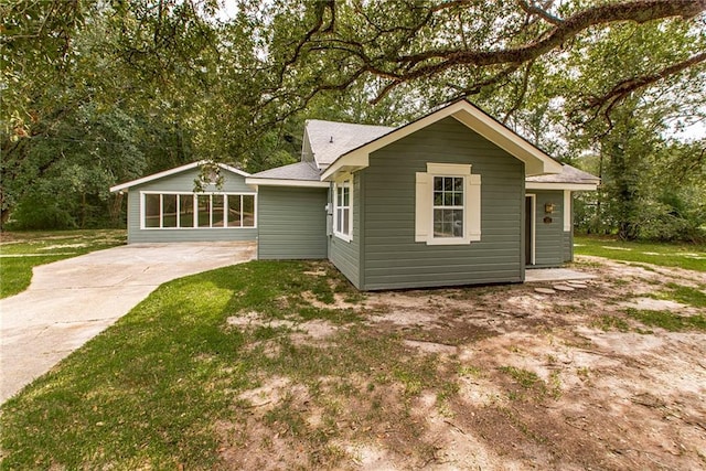 rear view of house with a sunroom and a patio area