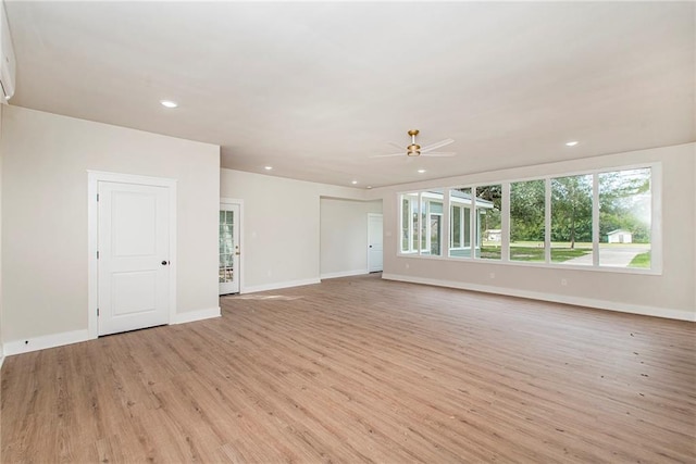 unfurnished room featuring light wood-type flooring and ceiling fan