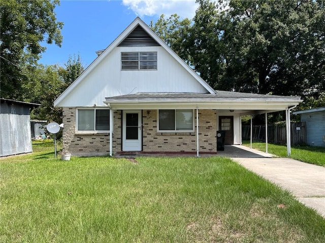 view of front facade with a carport and a front lawn