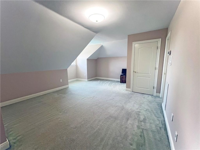 bonus room featuring carpet floors and vaulted ceiling