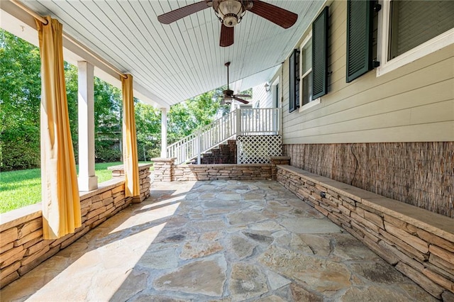 view of patio / terrace with ceiling fan and a porch