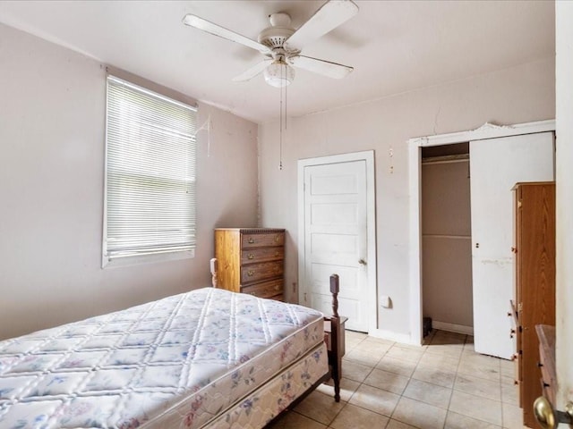 bedroom with ceiling fan, multiple windows, and light tile patterned floors