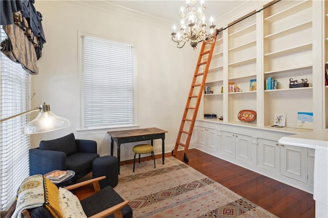 sitting room with plenty of natural light, ornamental molding, dark hardwood / wood-style floors, and a notable chandelier