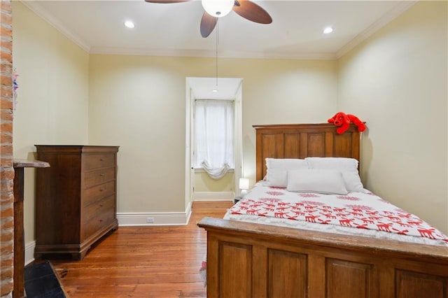 bedroom featuring crown molding, dark hardwood / wood-style floors, and ceiling fan