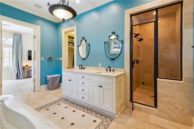 bathroom featuring ornamental molding, vanity, tile patterned floors, and a shower with shower door