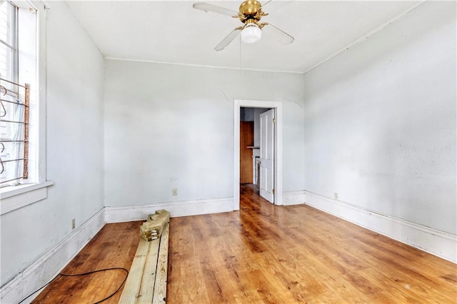 empty room featuring ceiling fan and light wood-type flooring