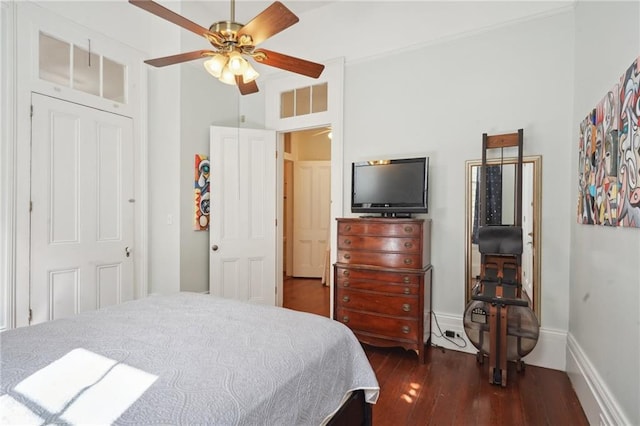 bedroom with ceiling fan and dark hardwood / wood-style flooring