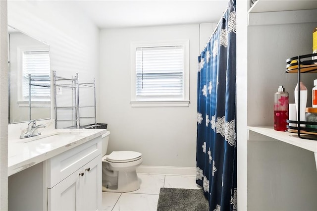 bathroom featuring vanity and toilet