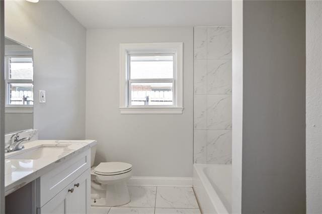 full bathroom with tiled shower / bath combo, vanity, and toilet